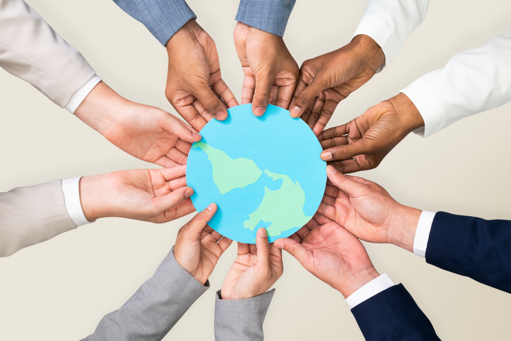hands holding earth csr business campaign.webp